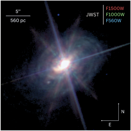 A Three colour image of the galaxy ESO 428-G14 as captured by the James Webb Space Telescope.